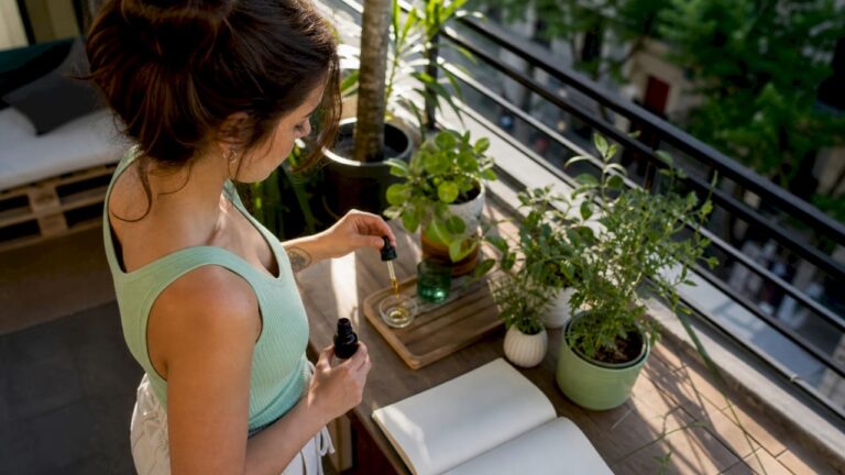 A person dosing their CBD at home